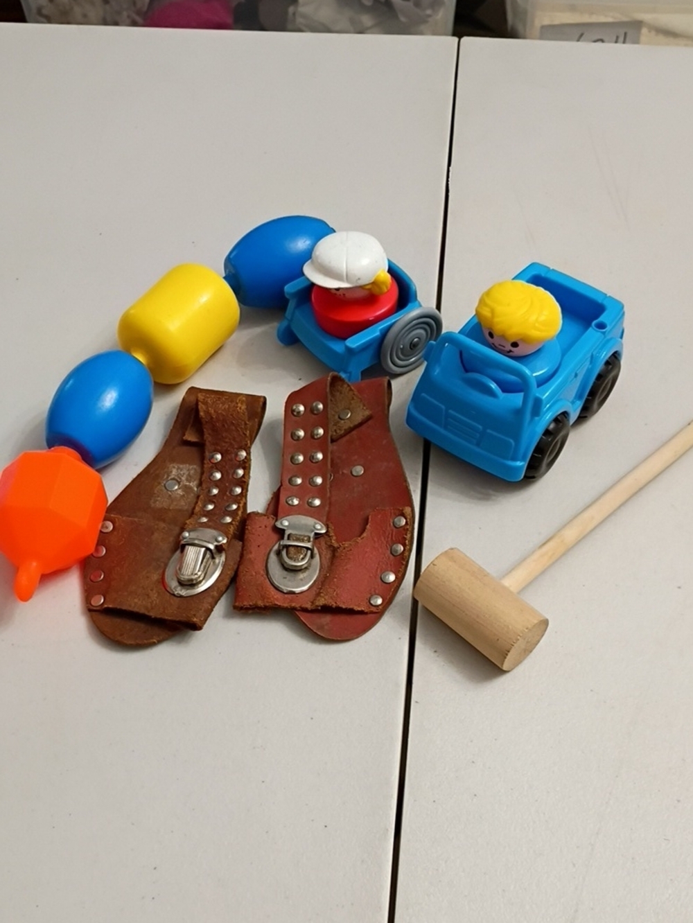 Vintage Blue Toy Car with Yellow and White Figures